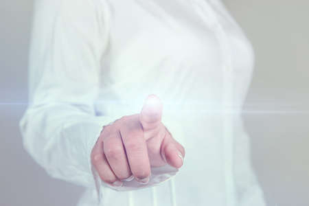 Business woman pressing touch screen templateの写真素材