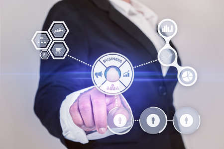 Attractive business woman activates touch screenの写真素材