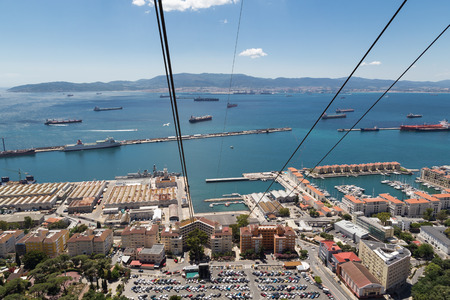 A view to Spain over the main port on Gibraltar from the cable car that ascends the rock の写真素材
