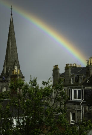 Rainbow over church steepleの写真素材