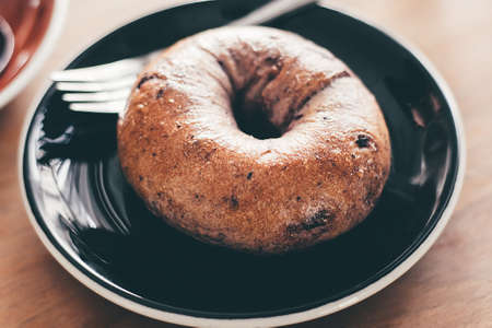 Plain bagel on serving dish