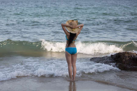 Shenzhen, Dorsal horn Beach, sunny, bikini girl with summer hatのeditorial素材