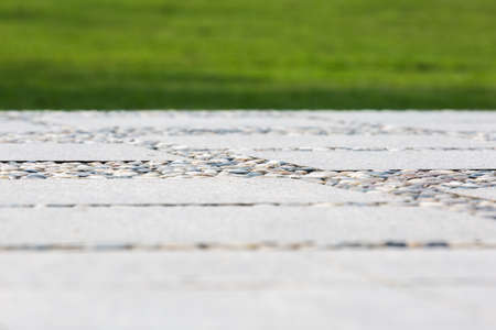 Grass and stone pavementの写真素材