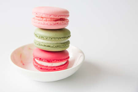 Macaroons in a white bowlの写真素材