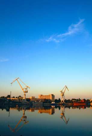 Wide-angle photo of cranes in a shipbuilding plantの写真素材
