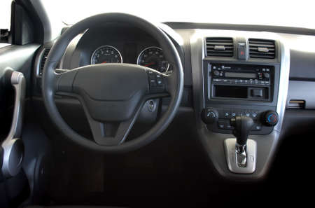 Interior of a car with view on steering wheel and dashboardの写真素材