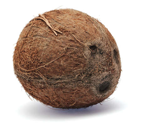 Whole coconut isolated on white background