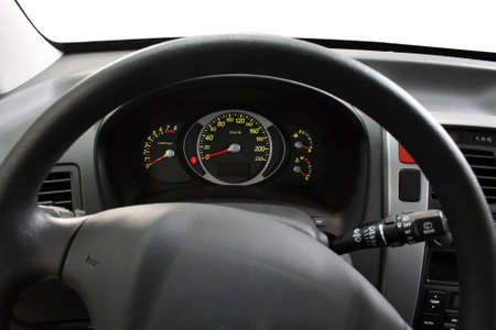 Illuminated dashboard and steering wheel of a modern carの写真素材