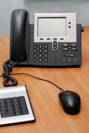 Modern digital phone on office table