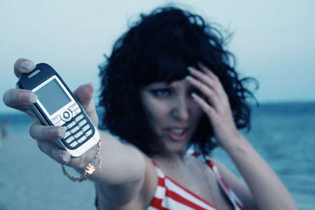 Young ladyu holding a cell phone
