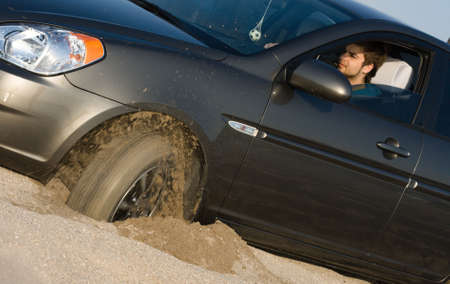Car stuck in sandの写真素材