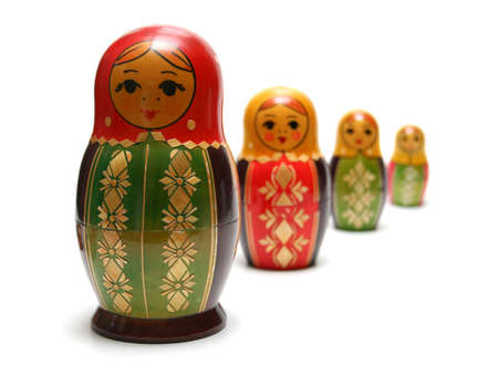 Traditional russian matreshka toys in a row, with focus on first figureの写真素材