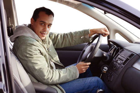 Young driver sitting in his new car