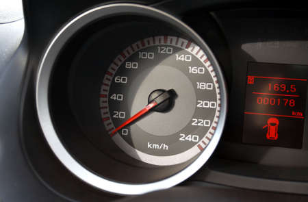 Speedometer and odometer on the car dashboard.