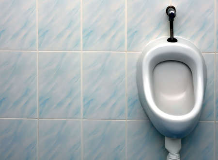 Public urinal with space for textの写真素材