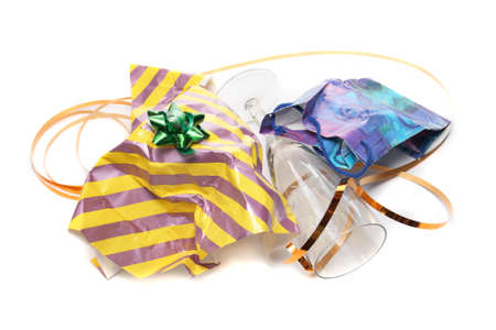 Crumpled wrapping and empty glasses isolated on whiteの写真素材