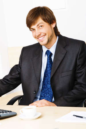 Successful businessman working at the computer in his officeの写真素材