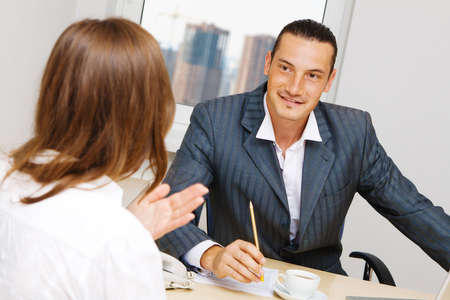 Professional advisor having a discussion with a customerの写真素材