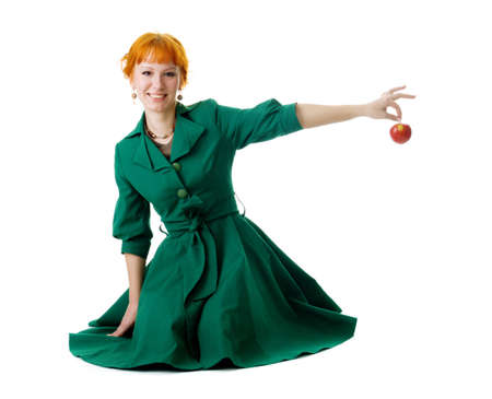 Beautiful lady holding an apple, white backgroundの写真素材