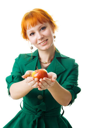 Beautiful lady holding an apple, white backgroundの写真素材
