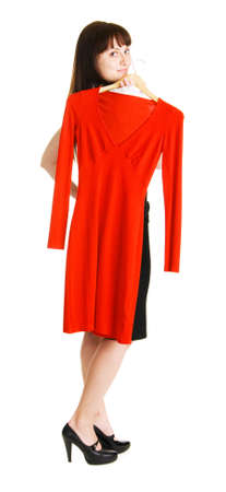 Beautiful lady trying on a red dressの写真素材