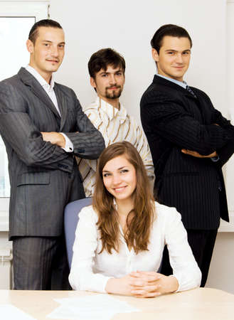 Successful business team, focus on men behindの写真素材
