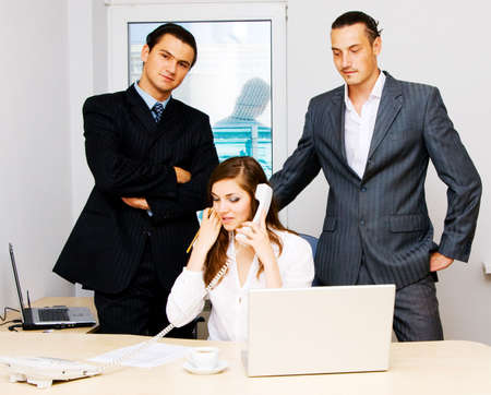 Successful business team of two men and one womanの写真素材
