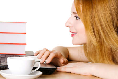 Young girl surfing the internet at her laptopの写真素材