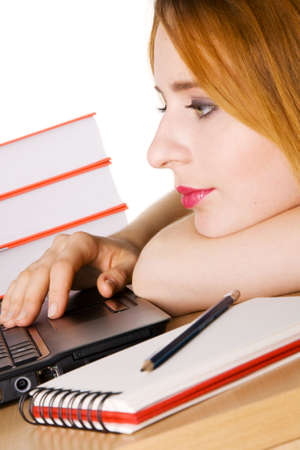 Young girl surfing the internet at her laptopの写真素材