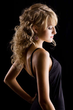 Young beautiful woman low-key portraitの写真素材