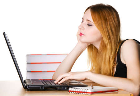 Young girl surfing the internet at her laptopの写真素材