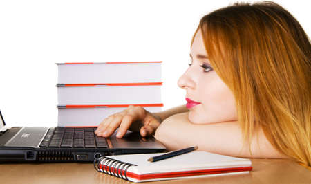 Young girl surfing the internet at her laptopの写真素材