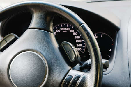 Illuminated dashboard and steering wheel of a modern carの写真素材