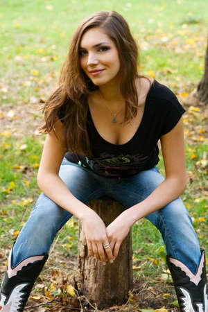 Happy young beautiful woman in an autumn parkの写真素材