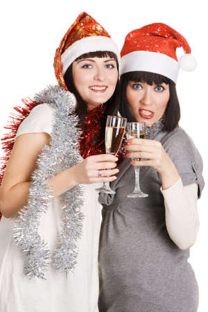 Christmas girls holding champagne glasses, isolated on white backgroundの写真素材