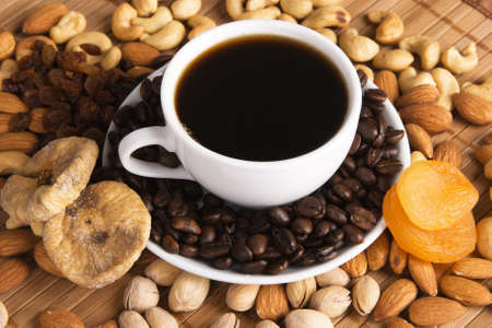 Coffee with nuts, fig and dried apricots still lifeの写真素材
