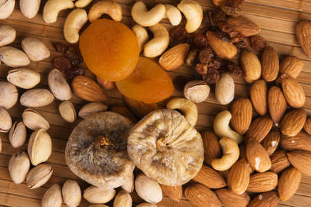 Nuts, fig and dried apricots still lifeの写真素材