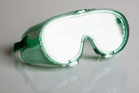 Safety glasses on gray background の写真素材