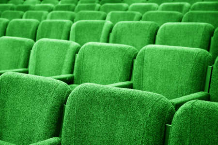 Closeup picture of chairs in empty cinema auditorium の写真素材