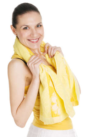 Beautiful young girl in sports outfit, white background の写真素材