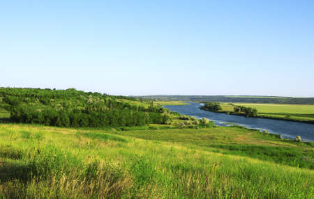Beautiful rural landscape with river and forest