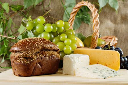 Bread, cheese and grapes still-lifeの写真素材