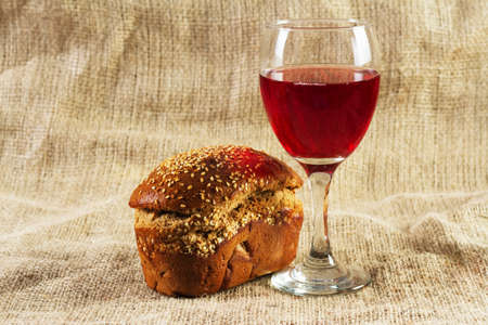 Red wine and grapes on vintage background, studio photoの写真素材