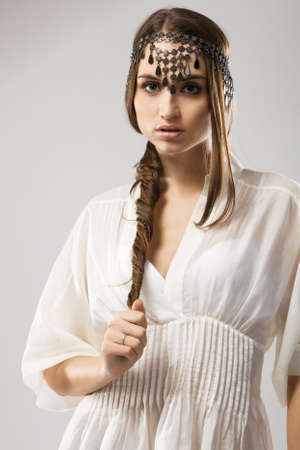 Fashion model in stylish dress, studio portraitの写真素材