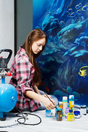 Professional painter at work, painting a home interiorの写真素材