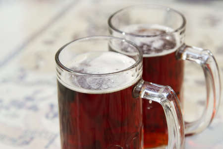 Two beer mugs closeup photoのeditorial素材