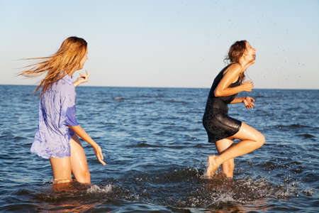 Two friends on a sea beachの写真素材