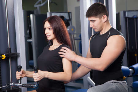 Portrait of a trainer in a fitness center