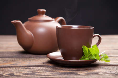 Tea with mint on a wooden table - studio still lifeの写真素材