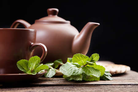 Tea with mint on a wooden table - studio still lifeの写真素材